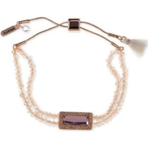 Rose gold tone adjustable bracelet with pink stone